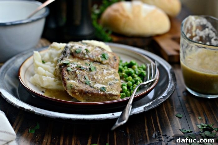 Slow Cooker Pork Chops with Herb Gravy, ready to be served
