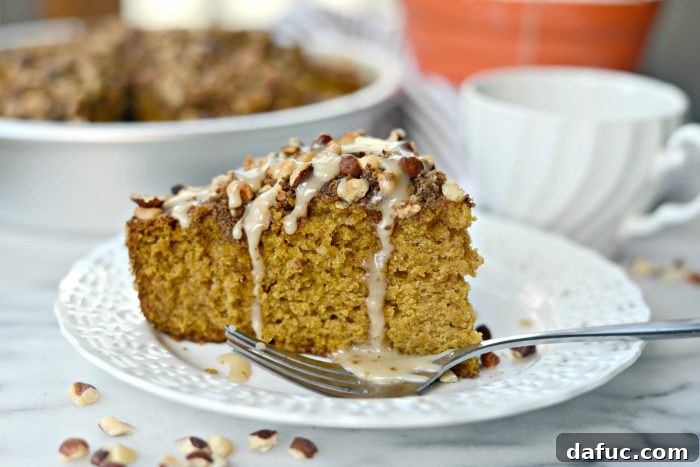 Pumpkin Coffee Cake with Hazelnut Streusel, sliced and ready to serve