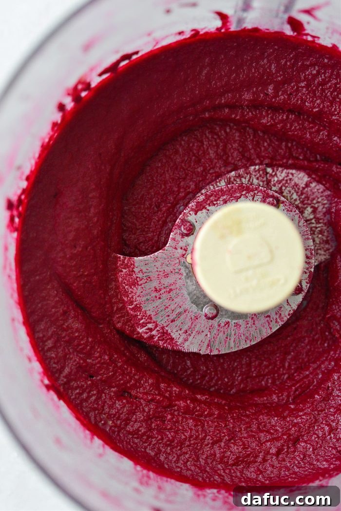 Vibrant Roasted Beet Hummus 11 A bowl of freshly blended, smooth Roasted Beet Hummus, ready to be served