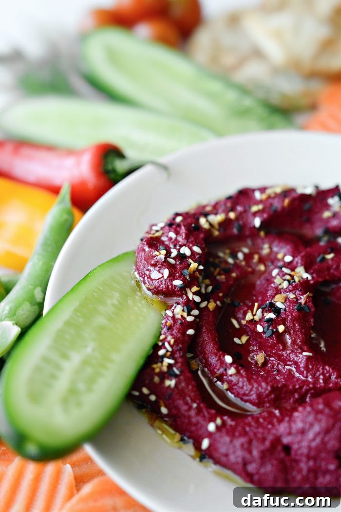 Crimson Root Hummus 3 Roasted Beet Hummus served with naan and vegetables
