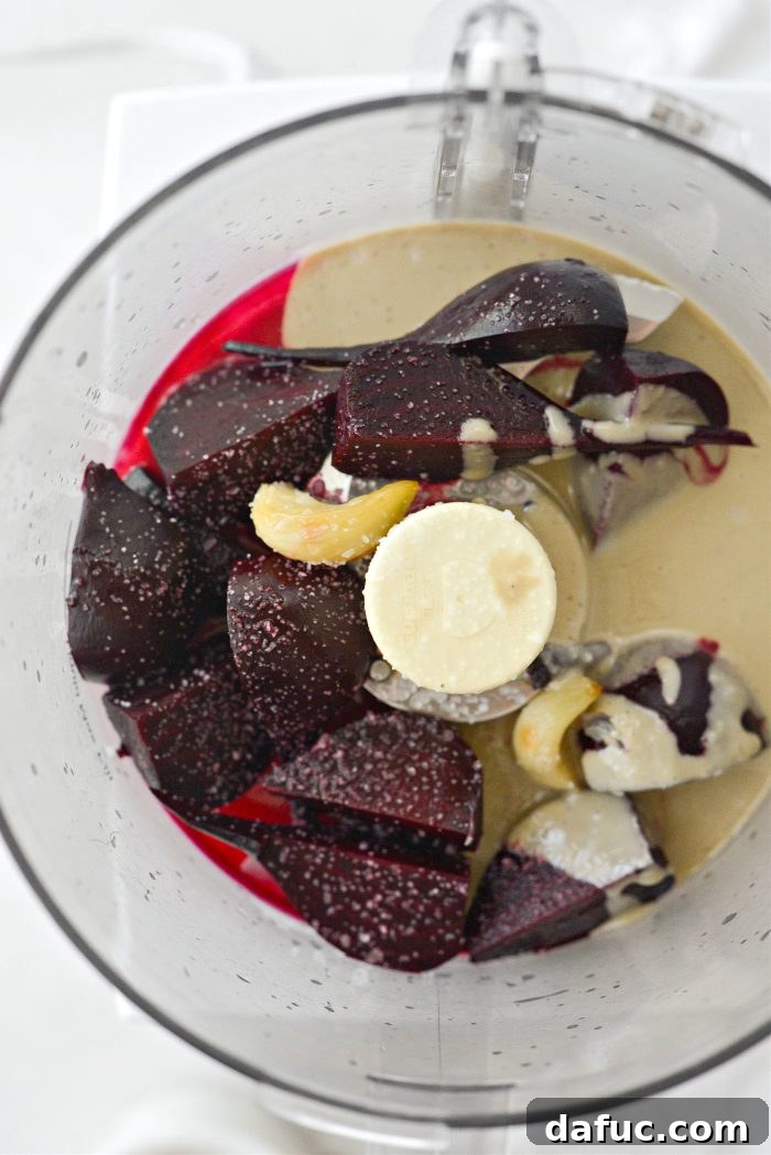 Vibrant Roasted Beet Hummus 9 Quartered roasted beets, peeled roasted garlic, lemon juice, and tahini in a food processor bowl