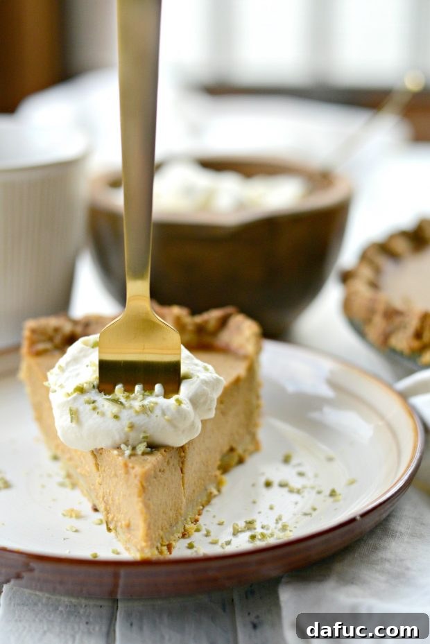 Exotic Chai Pumpkin Pie 11 Chai Pumpkin Pie ready to be sliced, garnished with whipped cream and spices