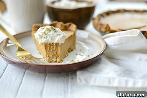 Exotic Chai Pumpkin Pie 12 Chai Pumpkin Pie slice on a plate with fork
