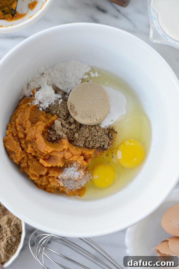 Exotic Chai Pumpkin Pie 4 Wet ingredients for Chai Pumpkin Pie in a mixing bowl