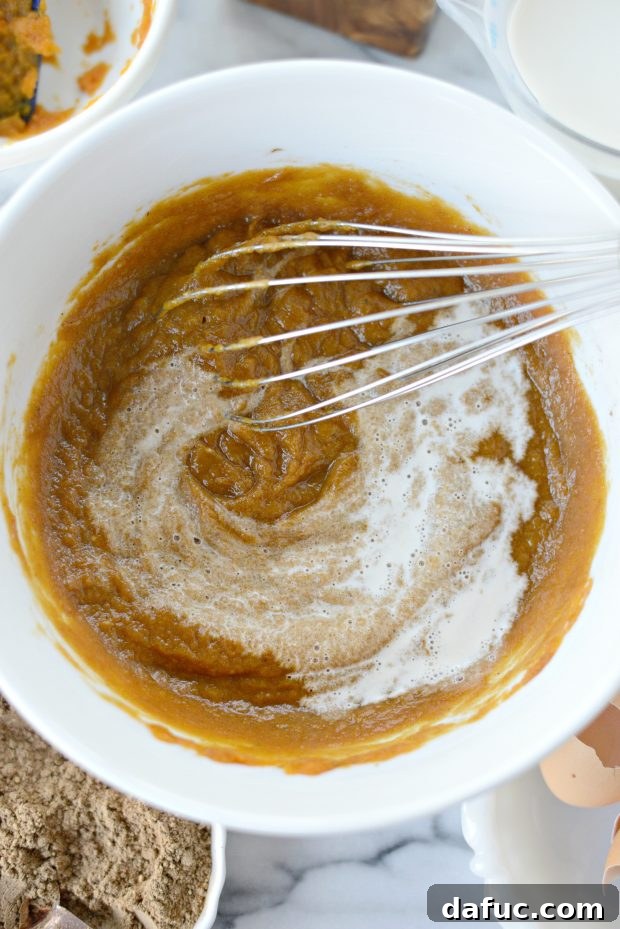 Exotic Chai Pumpkin Pie 6 Adding half and half to the Chai Pumpkin Pie filling