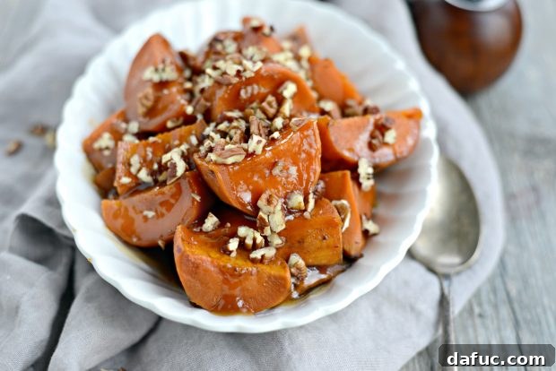 Delicious slow cooker candied sweet potatoes ready to serve for a holiday feast.