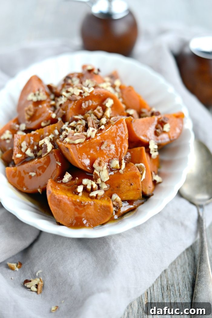 Beautifully caramelized slow cooker candied sweet potatoes, a perfect holiday side.