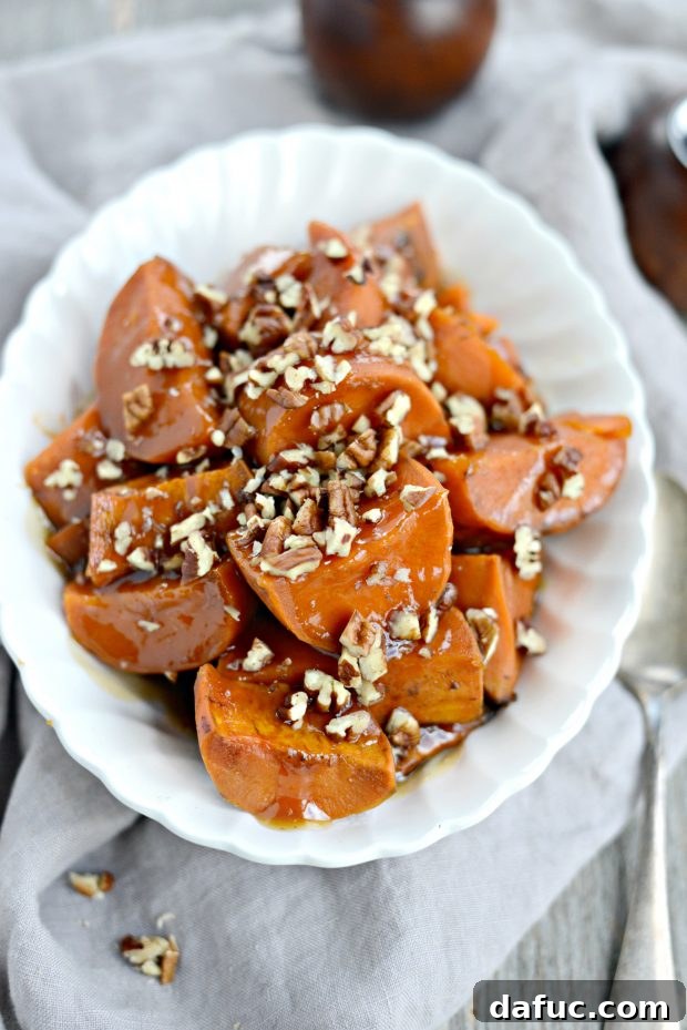 Festive display of slow cooker candied sweet potatoes in a decorative bowl.
