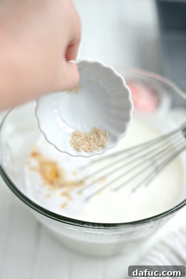 Adding vanilla extract to ice cream mixture