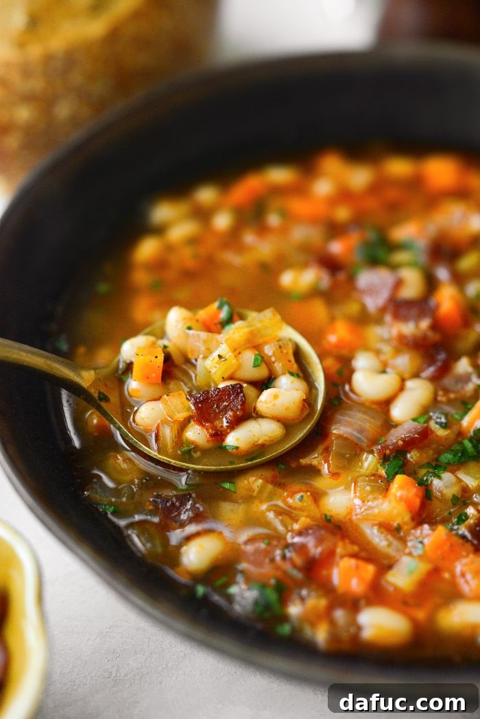 Smoky Bean and Bacon Delight 24 An appetizing image of Bean and Bacon Soup in a rustic setting, emphasizing its comforting appeal.