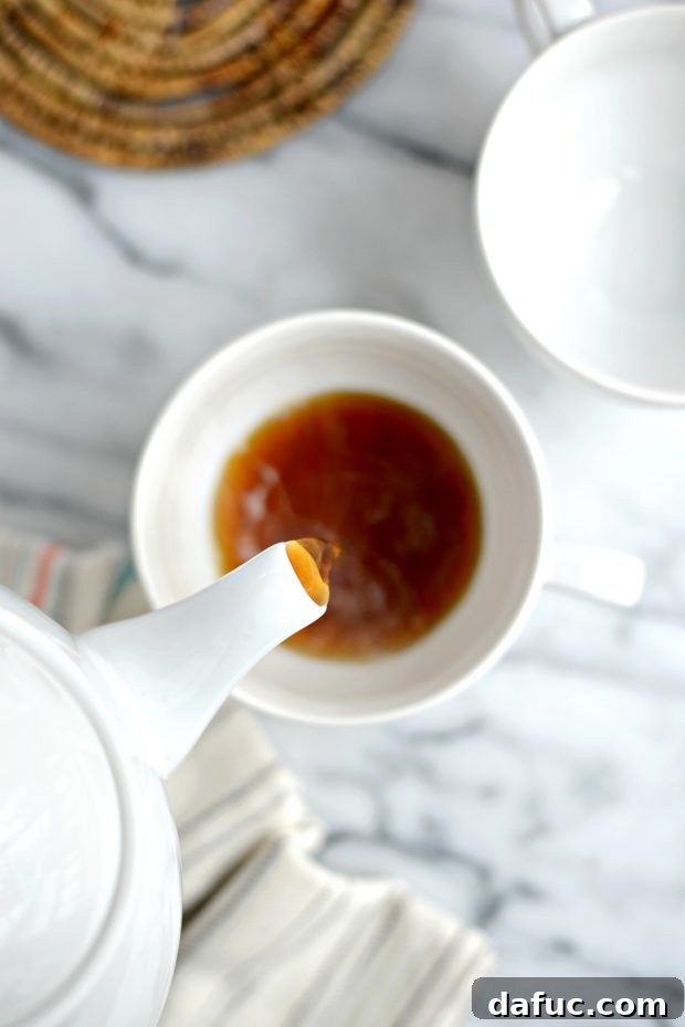 Spiced Comfort Masala Chai 13 Spiced milk simmering gently in a saucepan, infusing with flavors