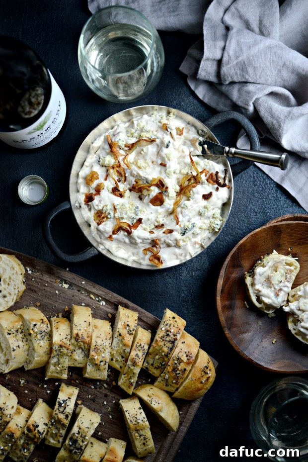 Sweet and Tangy Blue Cheese Shallot Dip 2 Caramelized Shallot and Blue Cheese Dip, a creamy and savory appetizer served with toasted baguette slices.