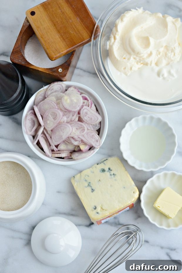 Sweet and Tangy Blue Cheese Shallot Dip 4 Close-up of the ingredients for Caramelized Shallot and Blue Cheese Dip, including shallots, butter, and blue cheese.