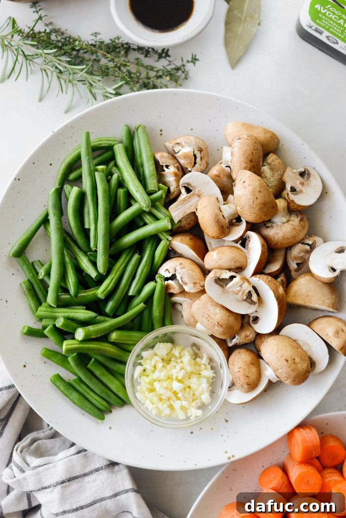 Plate of cleaned and chopped mushrooms, green beans, and garlic