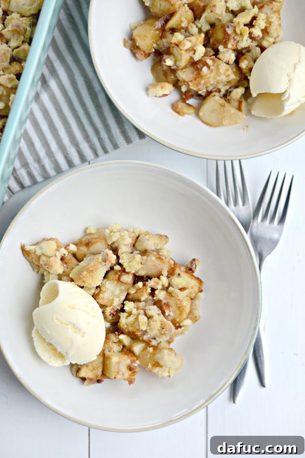 Close-up of baked Easy Apple Pear Crumble, showing the golden, crisp topping and bubbling fruit filling