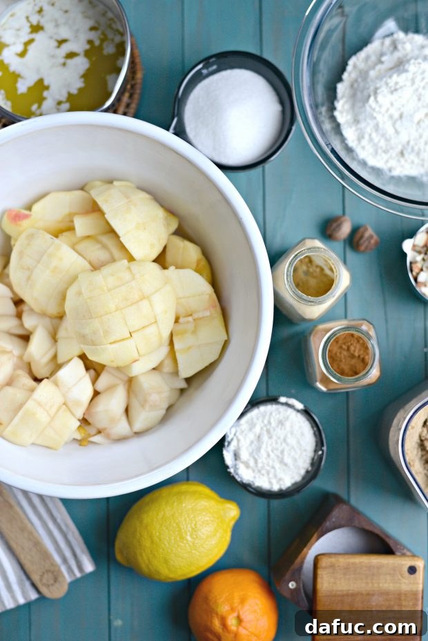 A scoop of vanilla ice cream melting gloriously over a warm serving of Easy Apple Pear Crumble