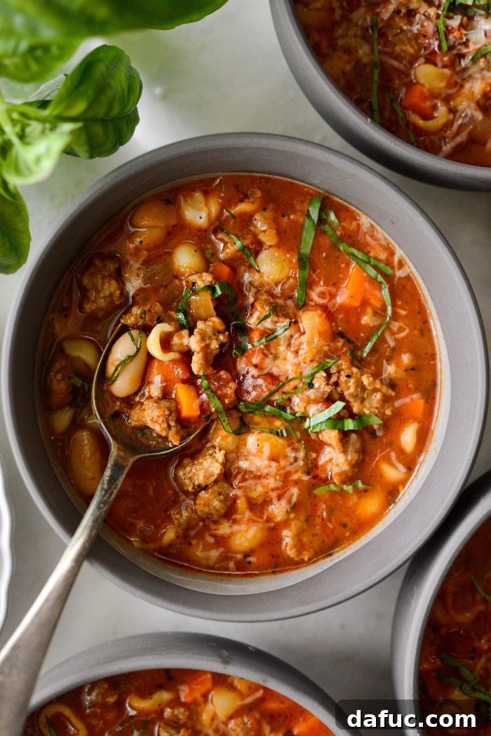 Appetizing presentation of Italian Sausage White Bean Soup served in a rustic bowl