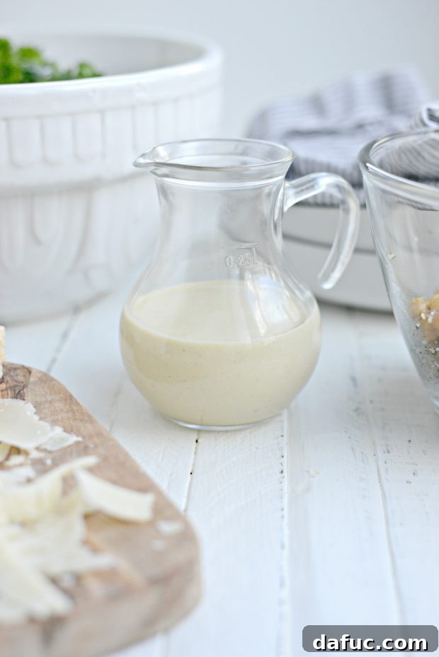 Creamy Tahini Kale Caesar Salad 7 Tahini Caesar Dressing being whisked in a bowl