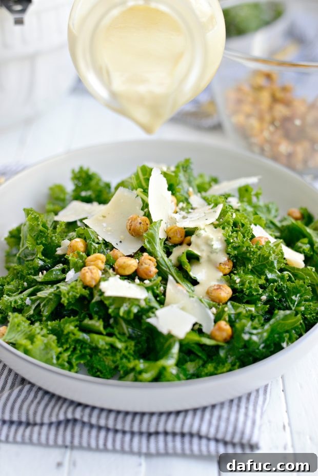 Creamy Tahini Kale Caesar Salad 10 Hands massaging kale with olive oil and salt