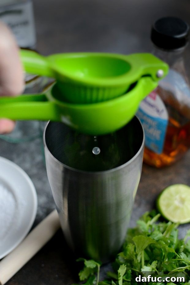 Zesty Cilantro Lime Margaritas 6 Muddling cilantro in a cocktail shaker for margarita mix