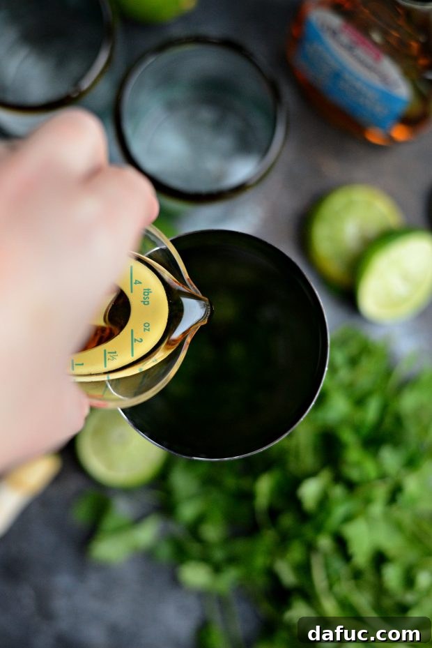 Zesty Cilantro Lime Margaritas 8 Muddling cilantro and lime in a cocktail shaker