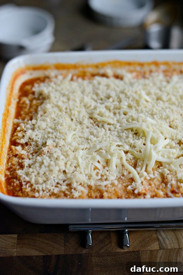 Easy One-Pan Chicken Parmesan Bake 11 Top with cheese and breadcrumbs