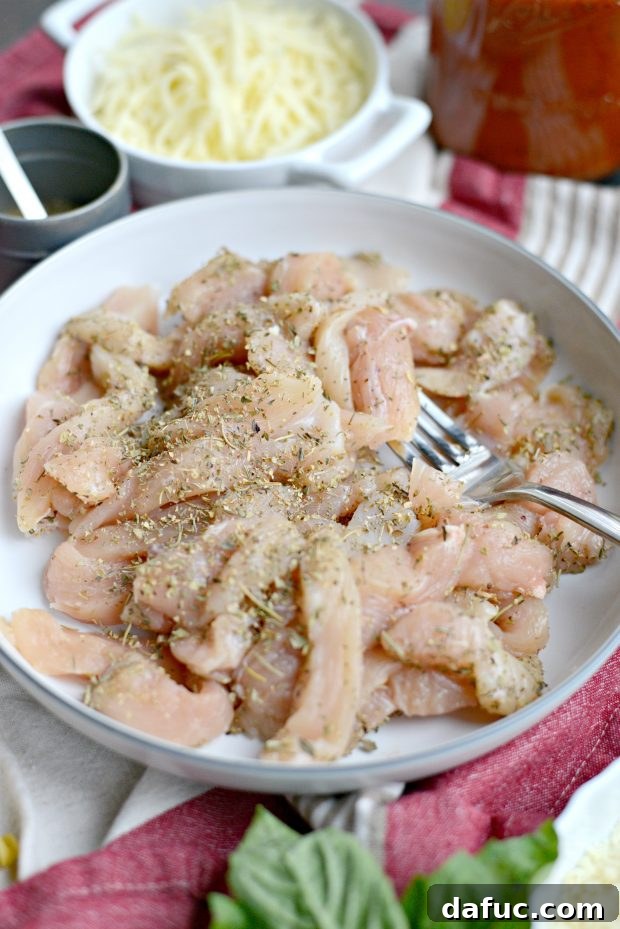 Easy One-Pan Chicken Parmesan Bake 5 toss chicken in seasoning