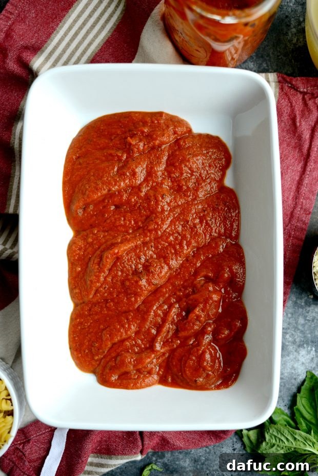 Easy One-Pan Chicken Parmesan Bake 6 sauce in baking dish.