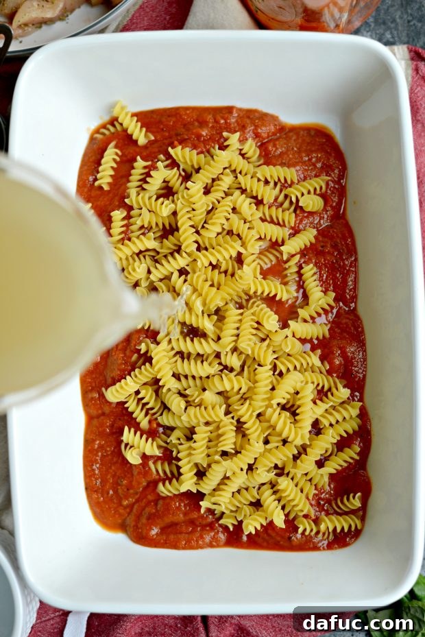 Easy One-Pan Chicken Parmesan Bake 8 pour in broth