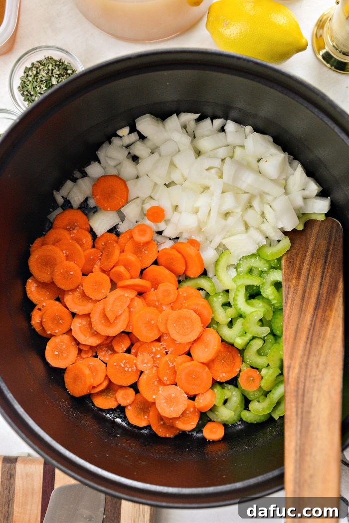 Bright Lemon Rosemary Chicken Noodle Soup 7 Adding olive oil, prepped vegetables, and salt to a Dutch oven
