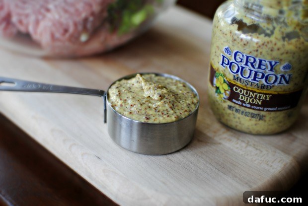 measure mustard Measuring coarse grained Dijon mustard for turkey burgers