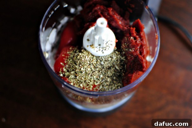 Spices and herbs added into the food processor for the sauce