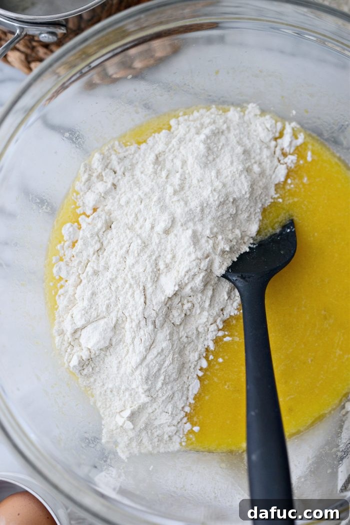 Irresistibly Easy Homemade Rolls 12 Gradually adding flour mixture to the wet ingredients