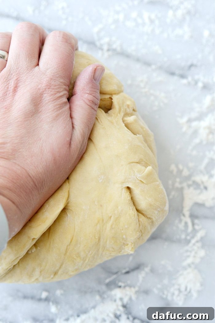 Irresistibly Easy Homemade Rolls 17 Kneading dough on a floured surface