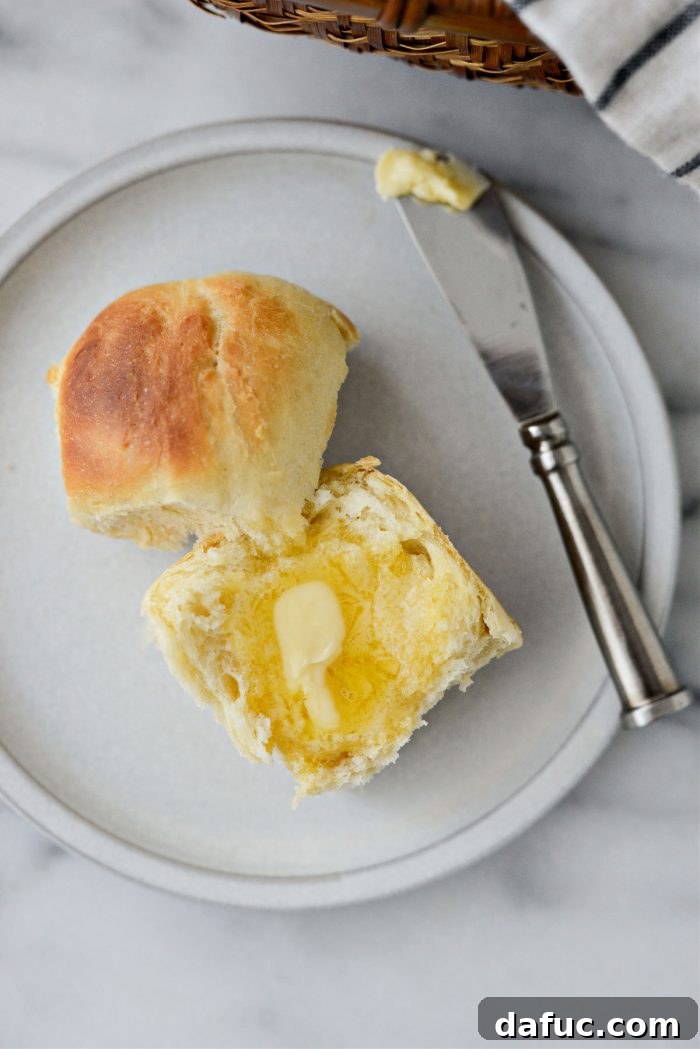 Irresistibly Easy Homemade Rolls 30 Easy Homemade Dinner Rolls with butter spread on them