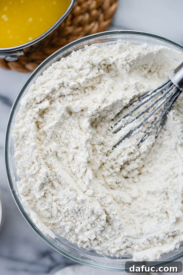 Irresistibly Easy Homemade Rolls 7 Flour and salt whisked together in a bowl