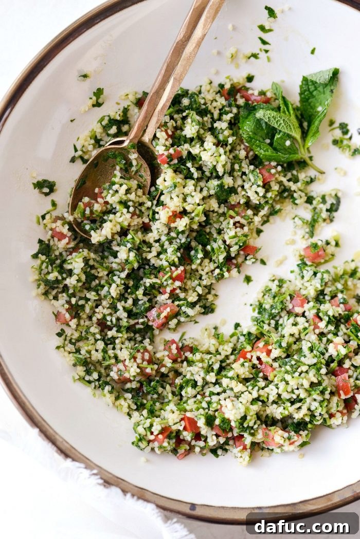 Garden Fresh Tabbouleh Delight 16 A close-up shot of homemade tabbouleh in an elegant cream bowl with a gold rim, perfectly garnished and ready to be served, highlighting its irresistible appeal.