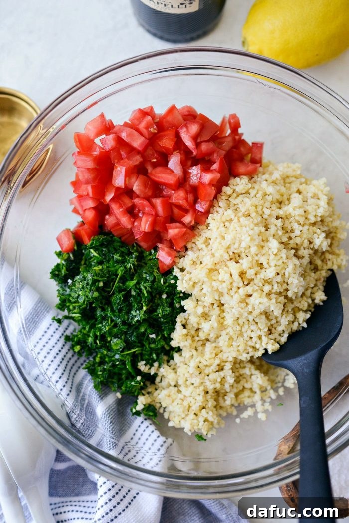 Garden Fresh Tabbouleh Delight 9 Finely minced parsley, mint, green onions, and garlic in a food processor, demonstrating the ideal consistency for tabbouleh.
