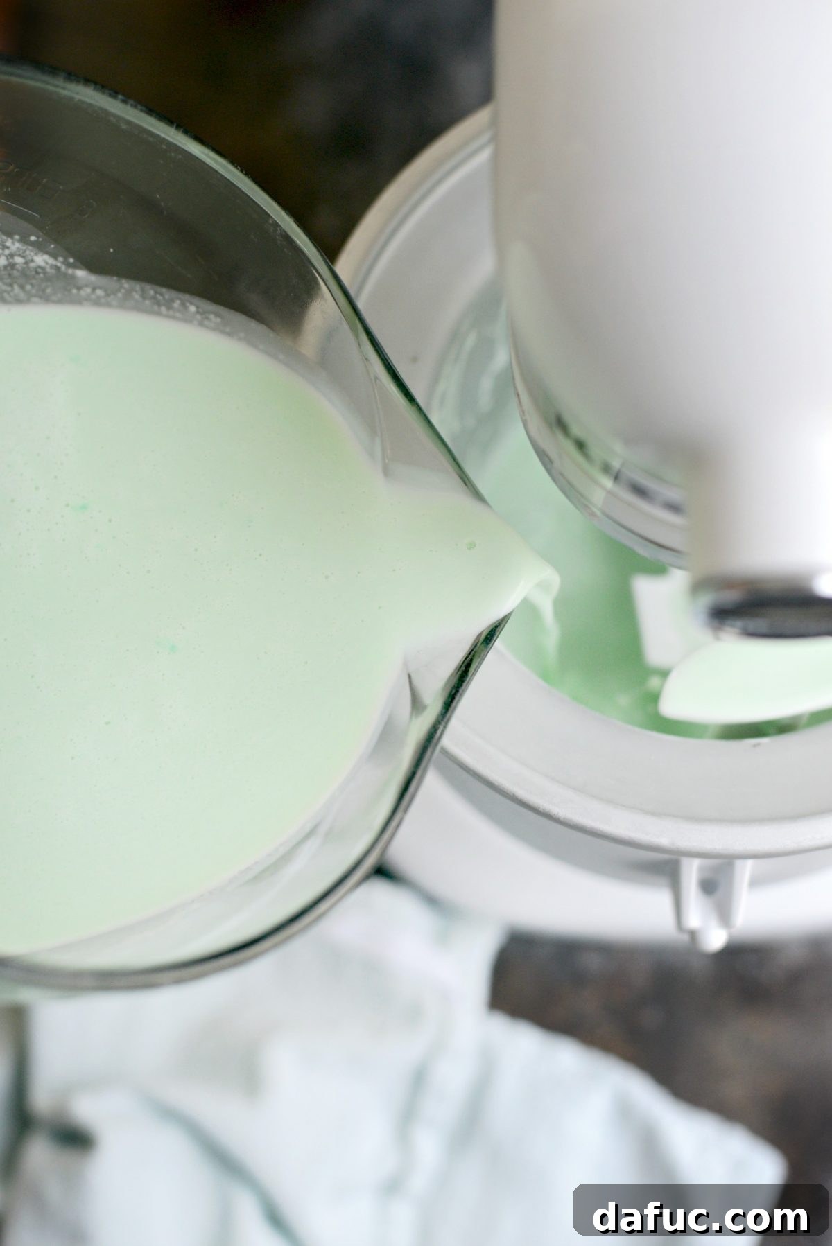 Pouring mixture into an ice cream maker