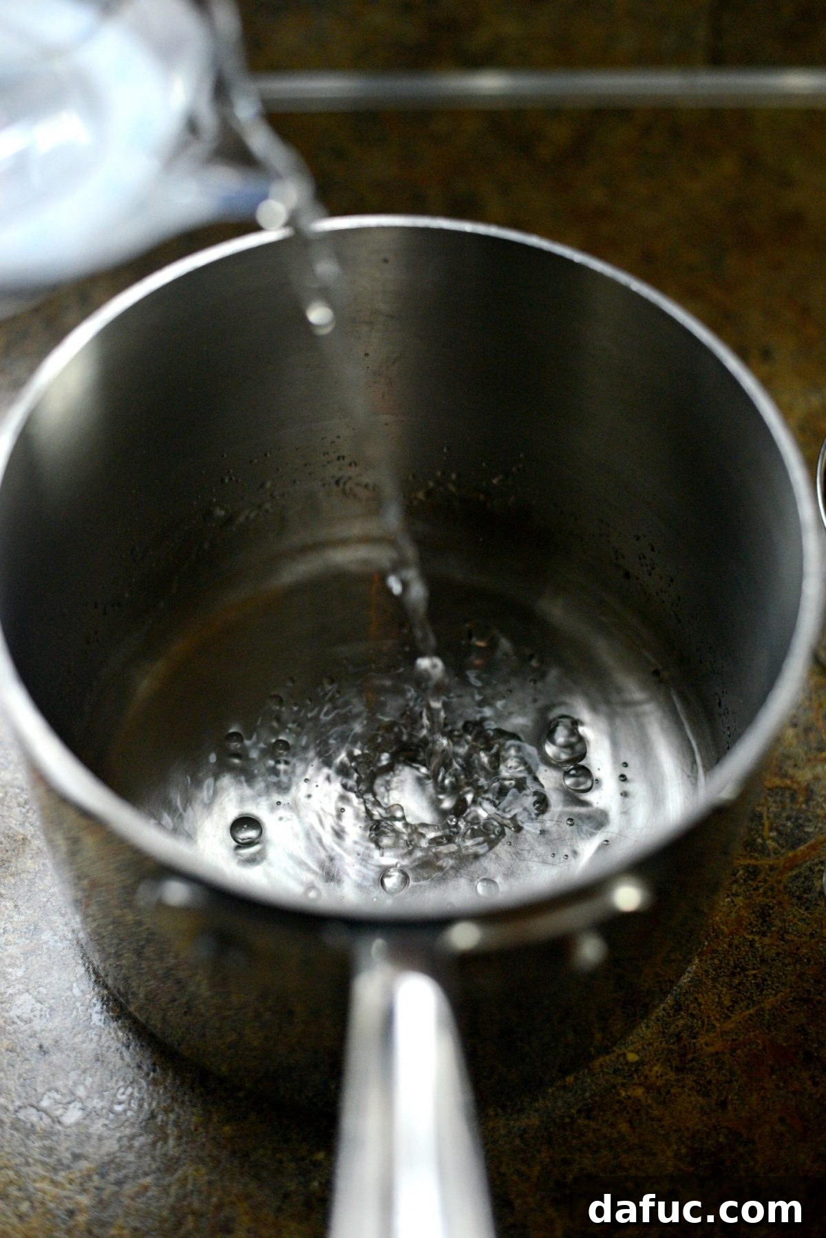 Foolproof Perfect Quinoa 5 Add water or broth to a saucepan.