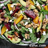 Roasted Beet Salad with Avocado, Goat Cheese and Candied Walnuts with Honey Dijon Vinaigrette