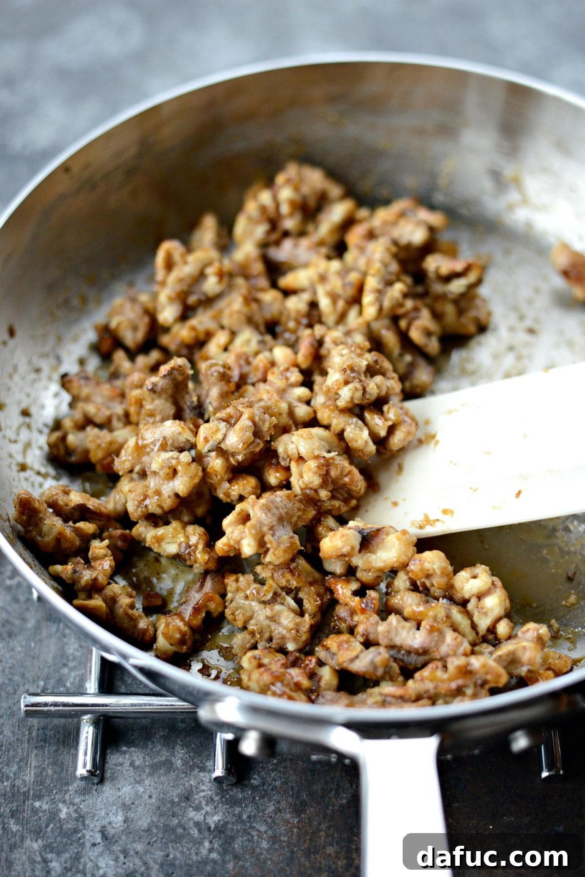 Honey-Kissed Roasted Beet Salad with Zesty Dijon 6 Walnuts and sugar heating in a skillet