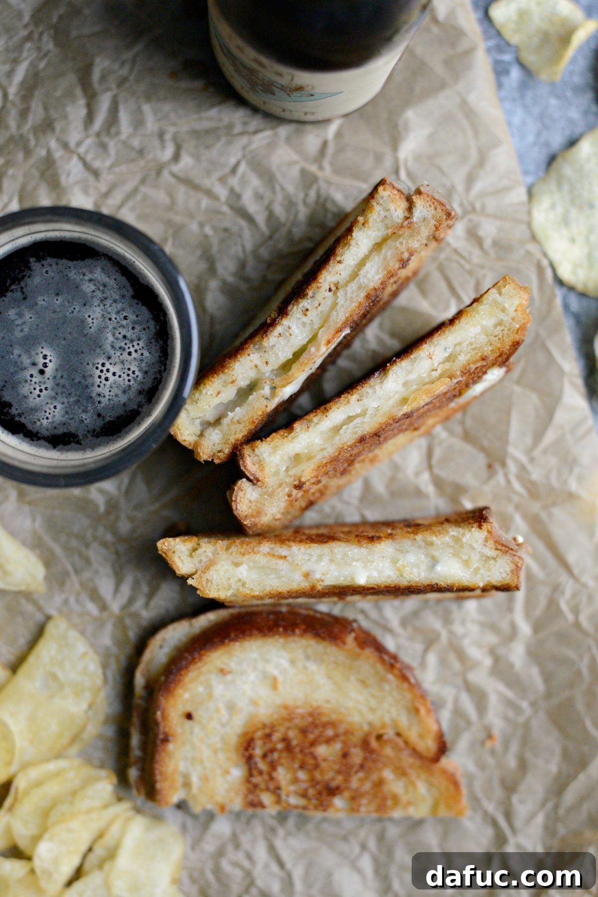 Gooey Fancy Three-Cheese Grilled Cheese Sandwich ready to be served