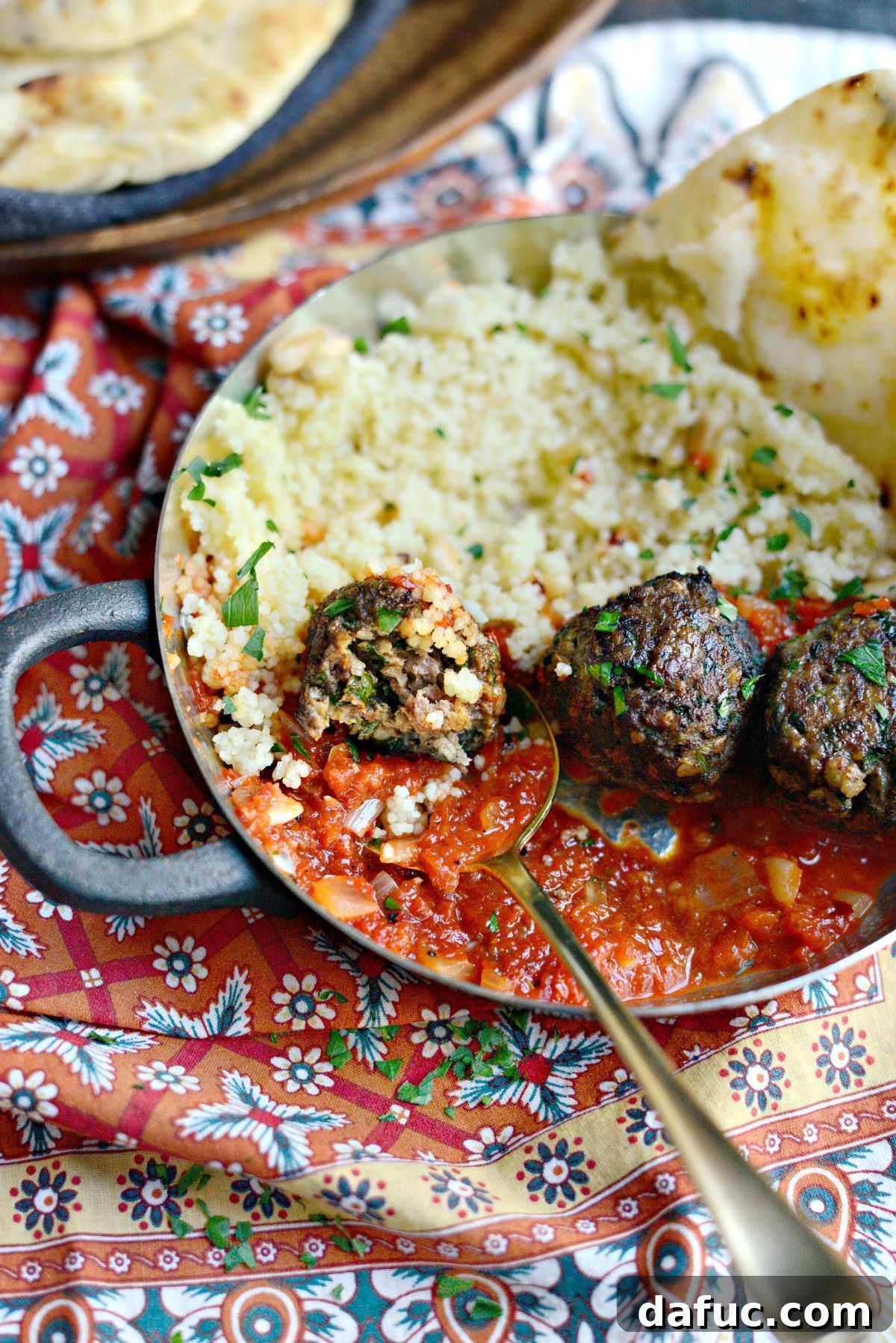 A final close-up of the delectable North African Spiced Lamb Meatballs and a bowl of bright red harissa sauce.