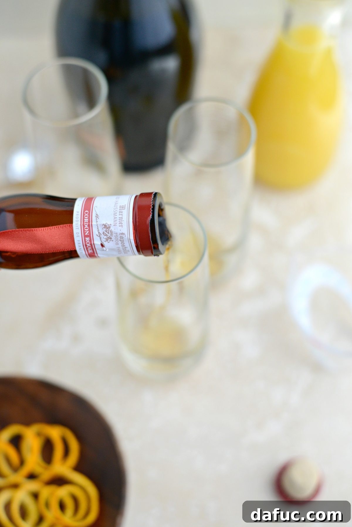 Mimosa Magic 5 pouring Grand Marnier