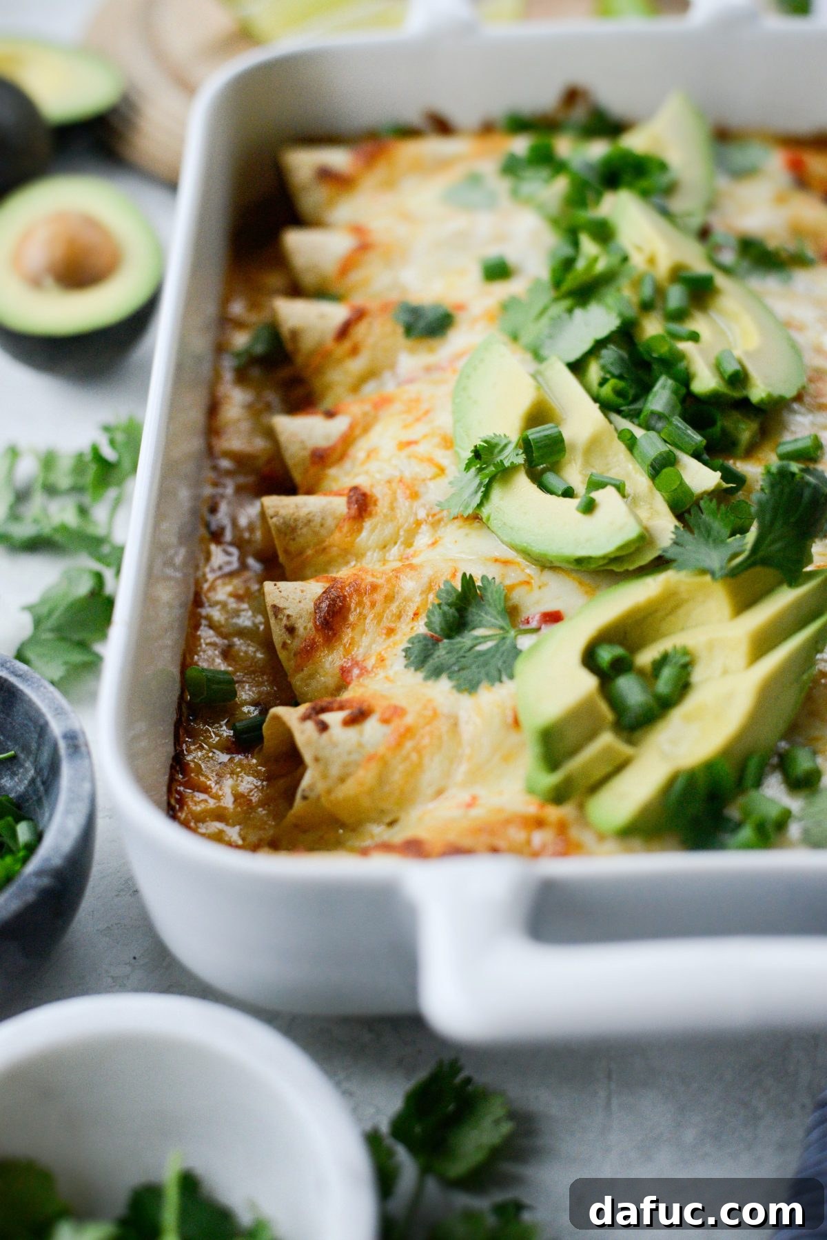 Serving Lighter Chicken Enchiladas with a variety of fresh toppings