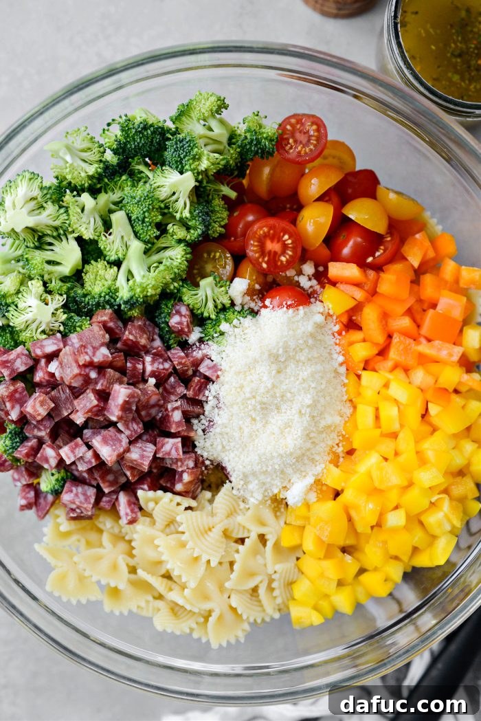 Mediterranean Bowtie Delight 10 Prepped salad ingredients in a large bowl