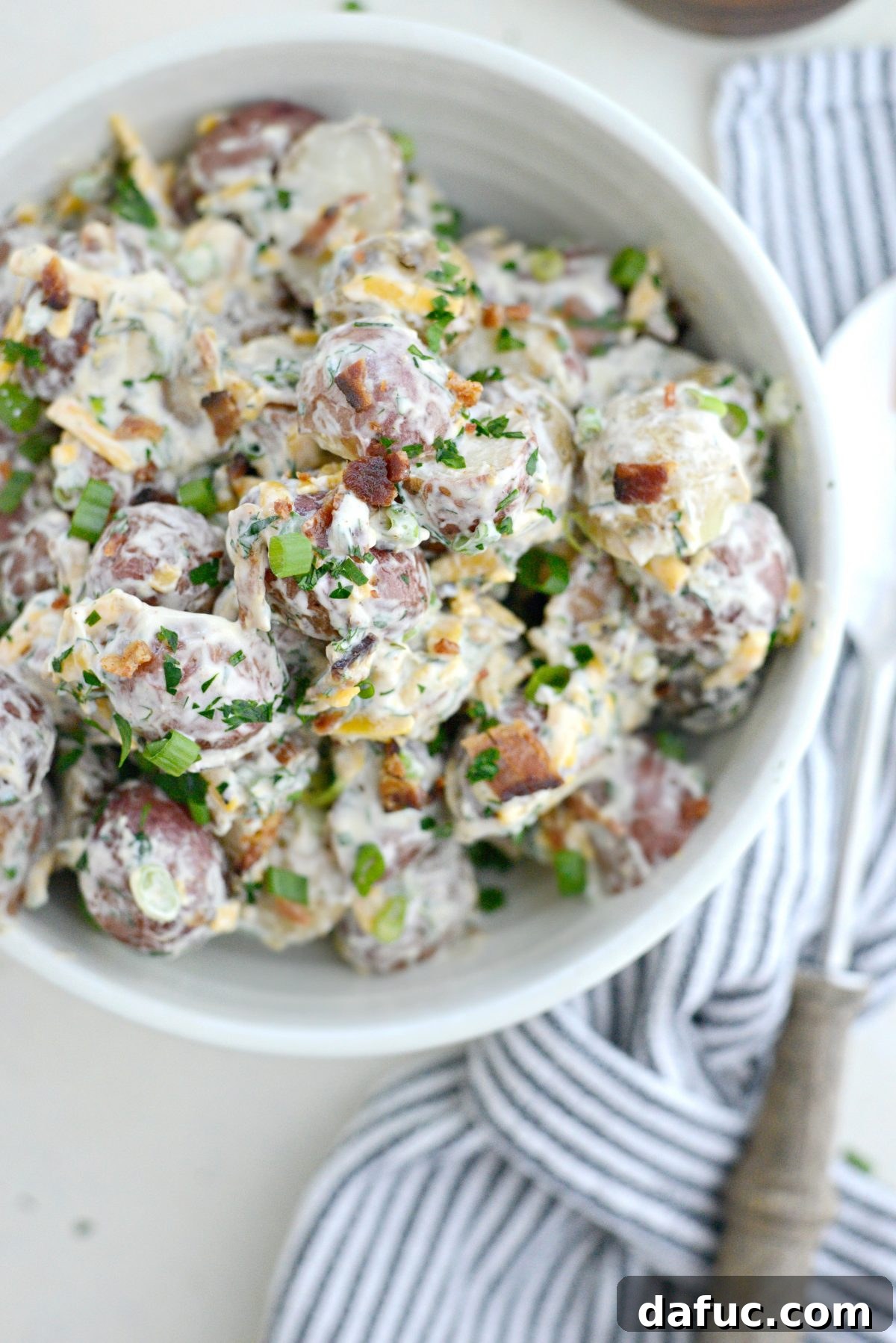 Bacon Cheddar Ranch Potato Salad, a rich and savory potato dish for barbecues.
