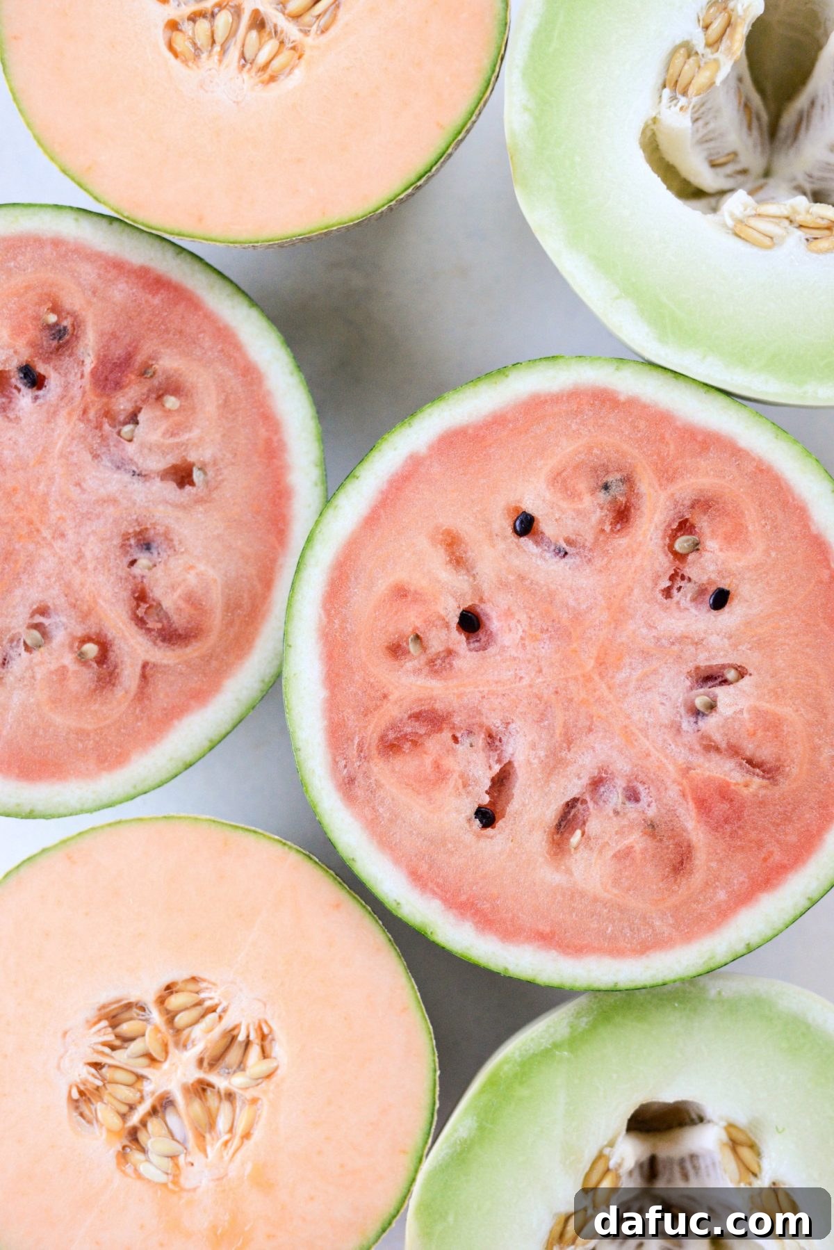 Honey Lime Mint Melon Delight 3 Close-up of three different types of melons: cantaloupe, honeydew, and watermelon
