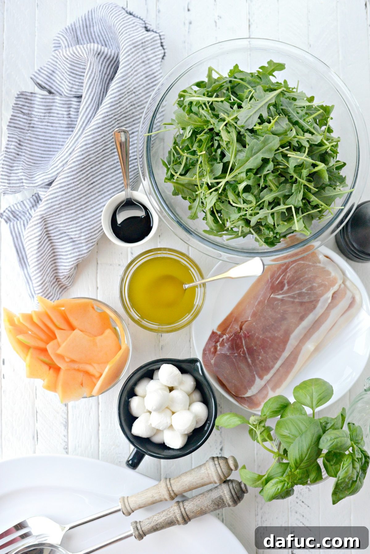 Golden Melon Prosciutto Arugula Fresca 4 Overhead shot of Cantaloupe and Prosciutto Arugula Caprese Salad, showcasing the artful arrangement of components